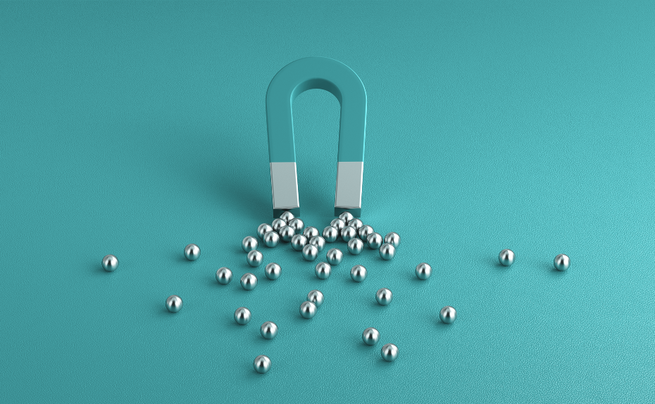 horseshoe-shaped magnet attracting metal balls